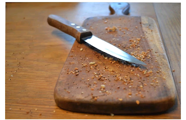 Kitchen chopping board and microorganisms Kitchen chopping board with knife